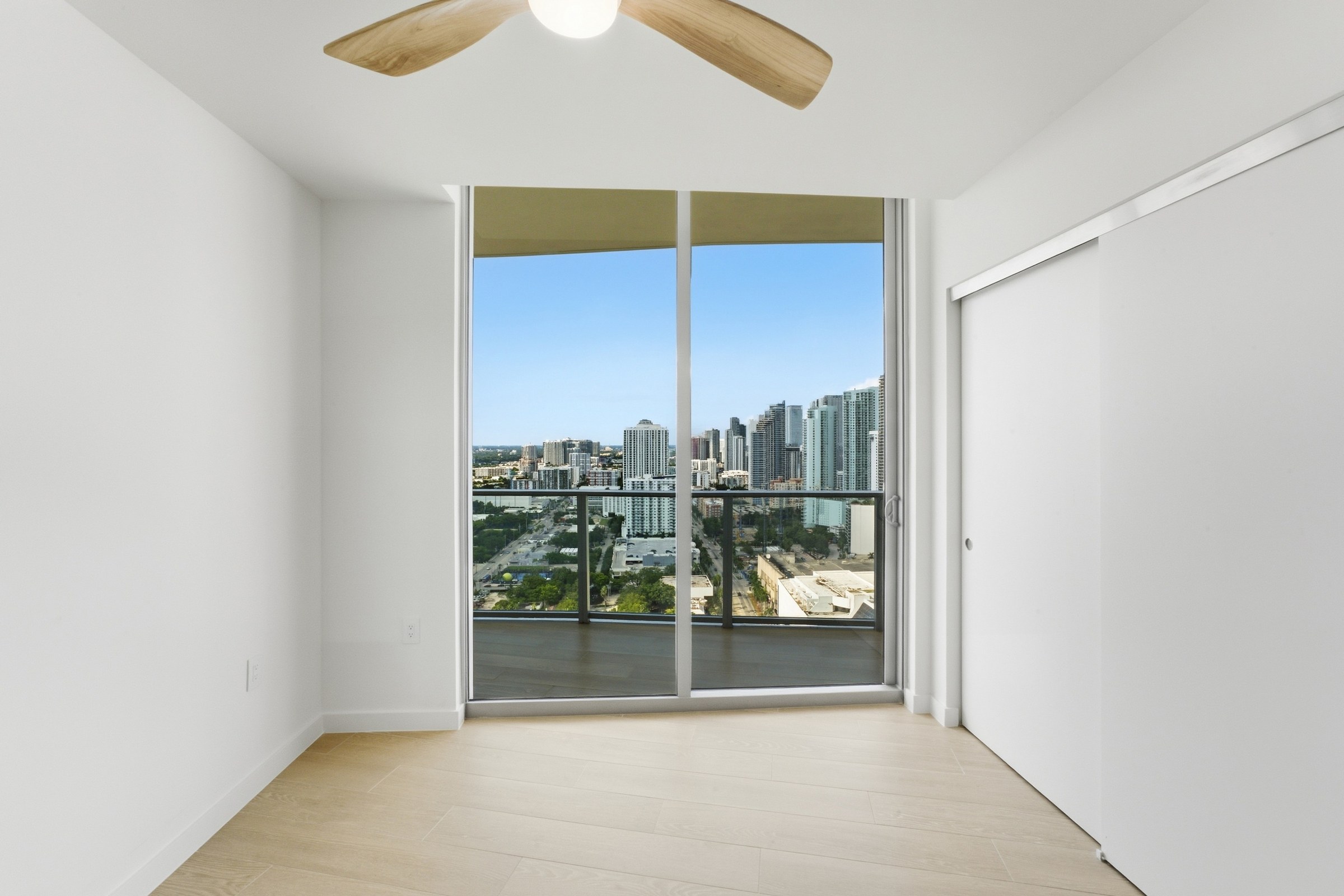 Bedroom opening to the private balcony at Residence 3007