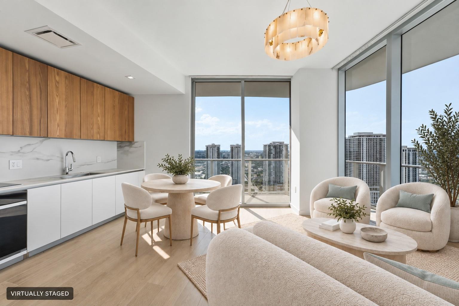 Virtually staged living and kitchen area with Downtown Miami views