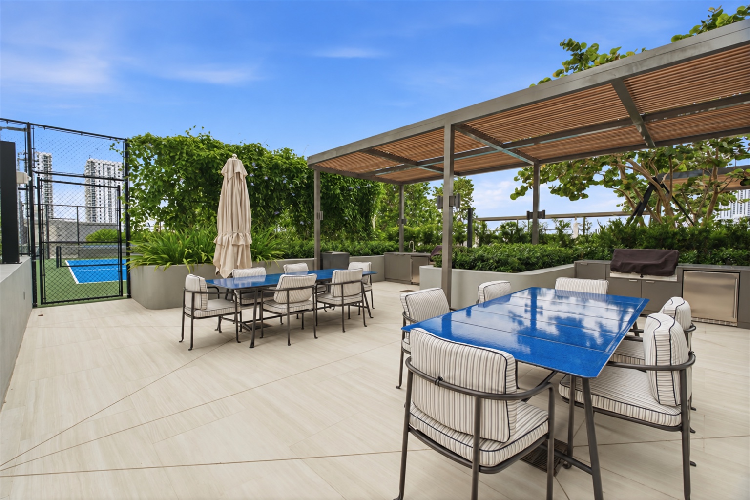 Shaded outdoor dining terrace at Casa Bella Residences