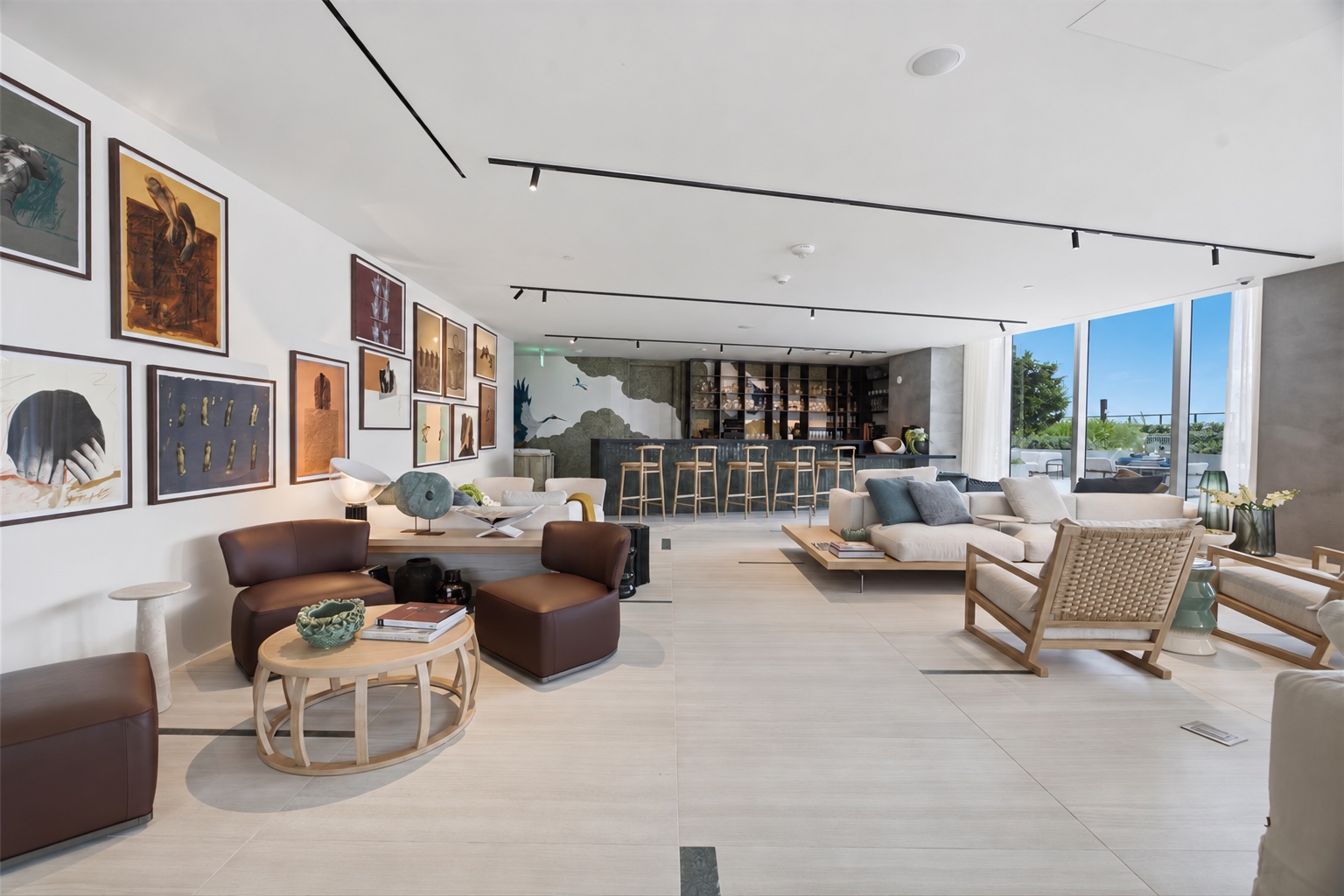 Open club lounge with art and terrace views