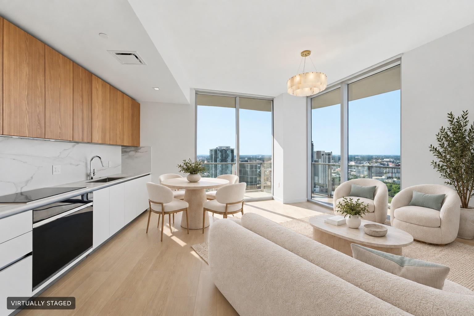 Virtually staged open living and dining area beside the kitchen