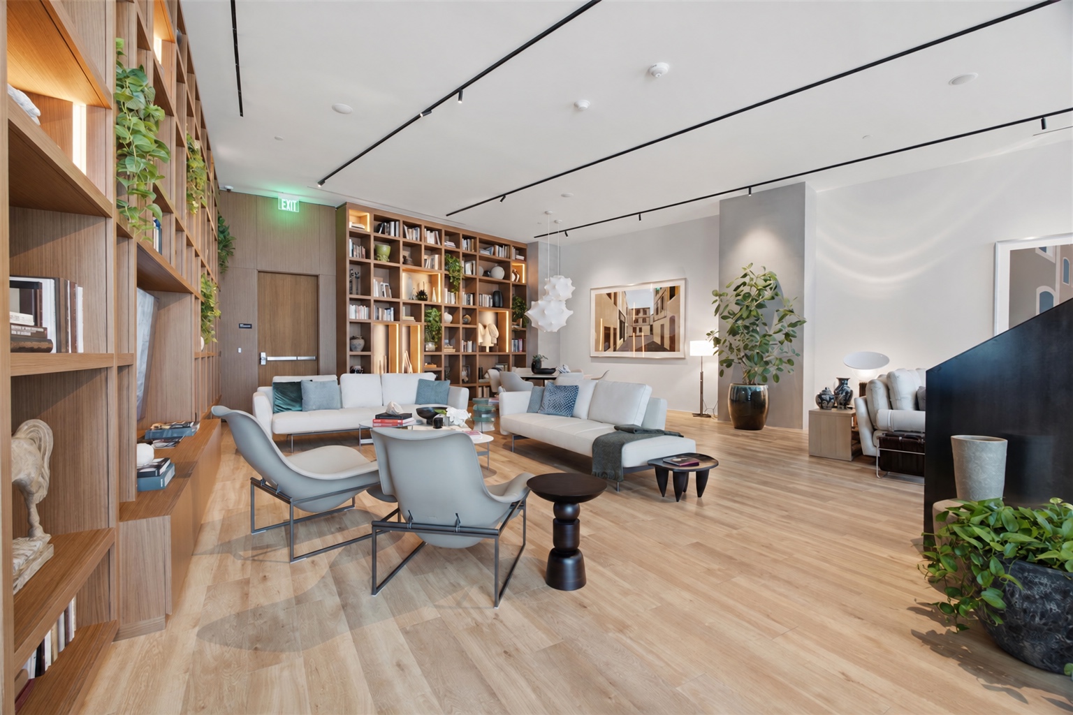 Casa Bella co-working lounge with library shelving
