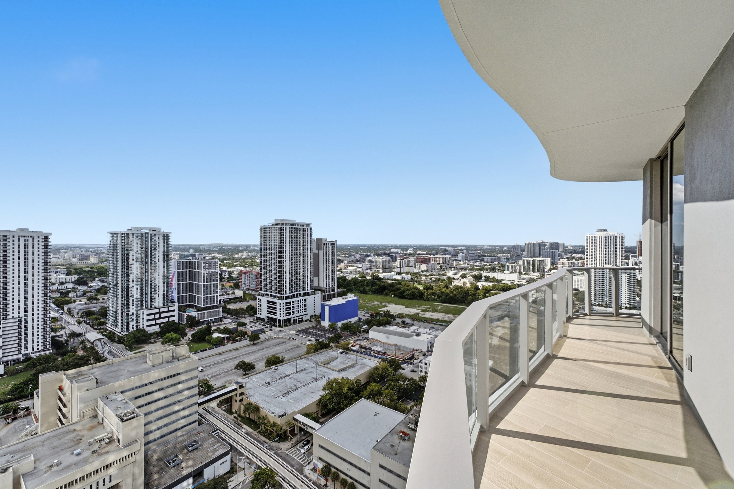 Curved private balcony with elevated western city views