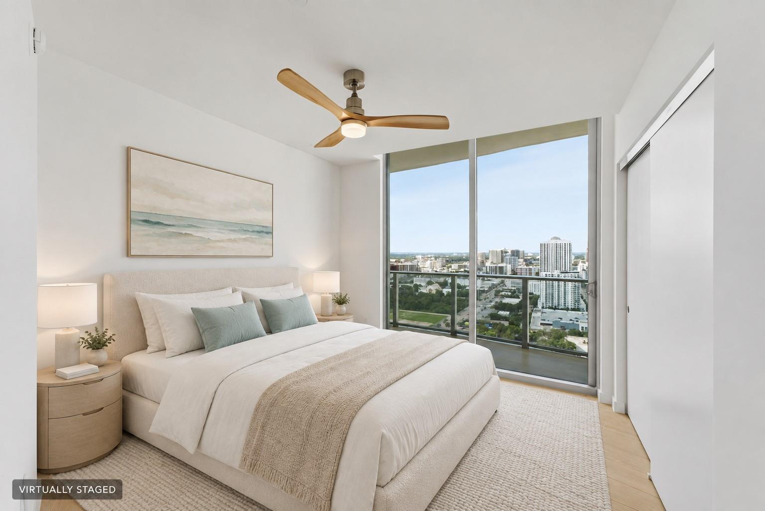 Virtually staged bedroom with private balcony and skyline outlook